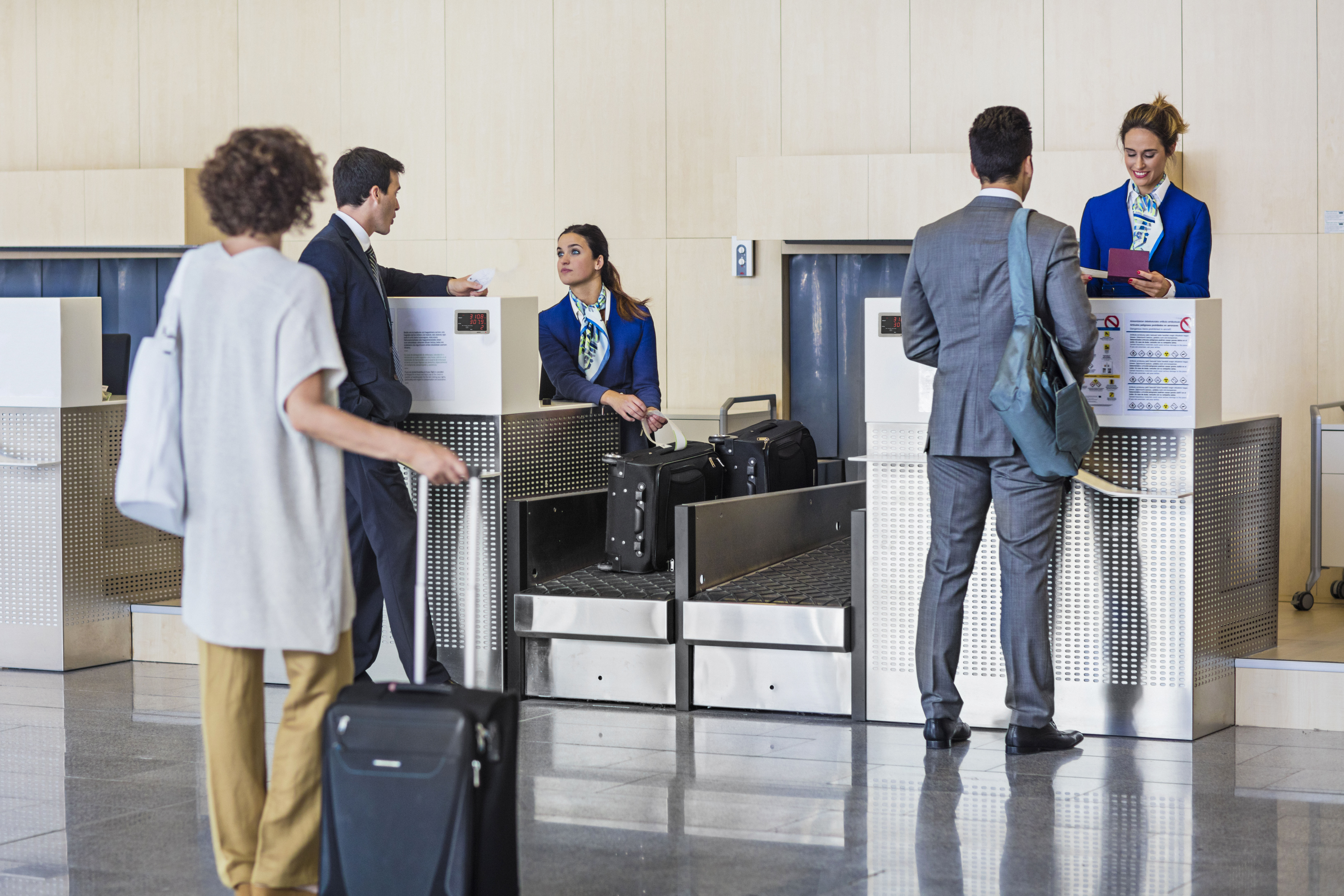 Business people checking in at the airport